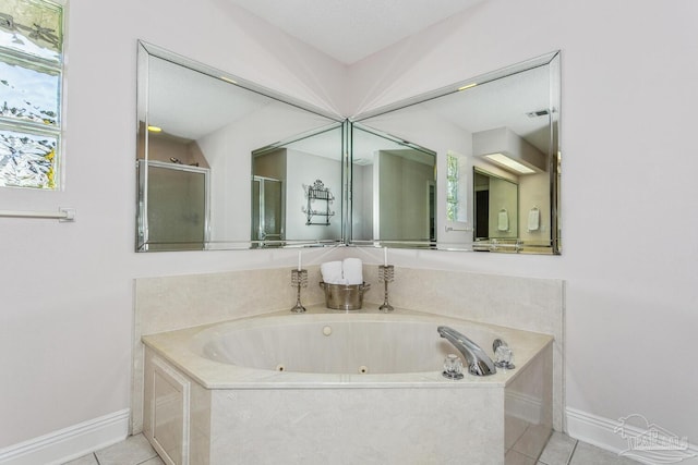 full bathroom featuring tile patterned flooring, visible vents, baseboards, a whirlpool tub, and a stall shower