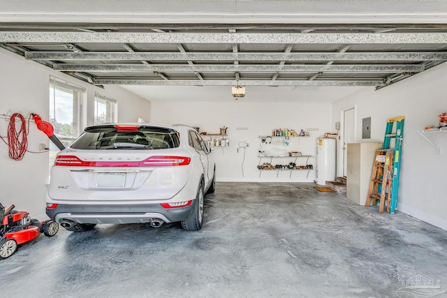 garage featuring electric panel, baseboards, a garage door opener, and water heater