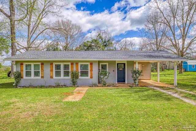 ranch-style home with a front lawn, a carport, roof with shingles, and driveway