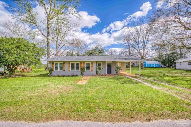 ranch-style house with an attached carport, driveway, and a front lawn