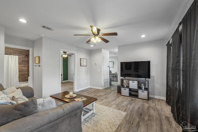 living room with visible vents, recessed lighting, ceiling fan, and wood finished floors