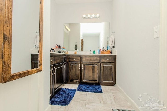 bathroom featuring vanity and tile patterned flooring