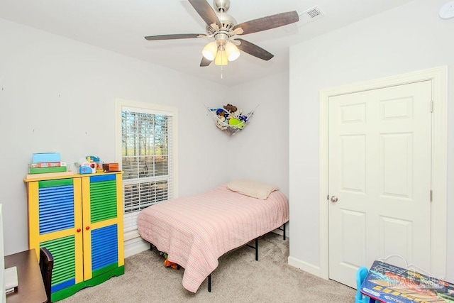 carpeted bedroom with ceiling fan