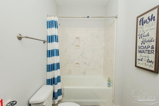 bathroom with toilet and shower / bath combo with shower curtain