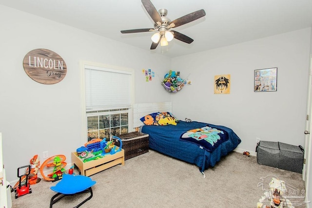 bedroom featuring ceiling fan and carpet