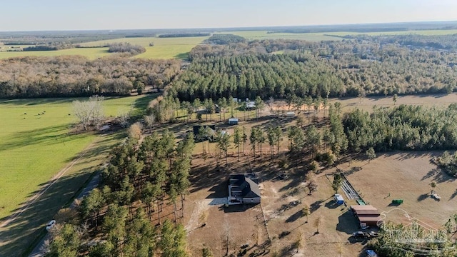 birds eye view of property with a rural view