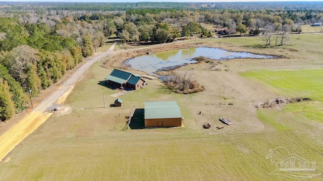 birds eye view of property featuring a water view, a view of trees, and a rural view