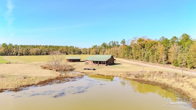 view of local wilderness featuring a water view and a view of trees