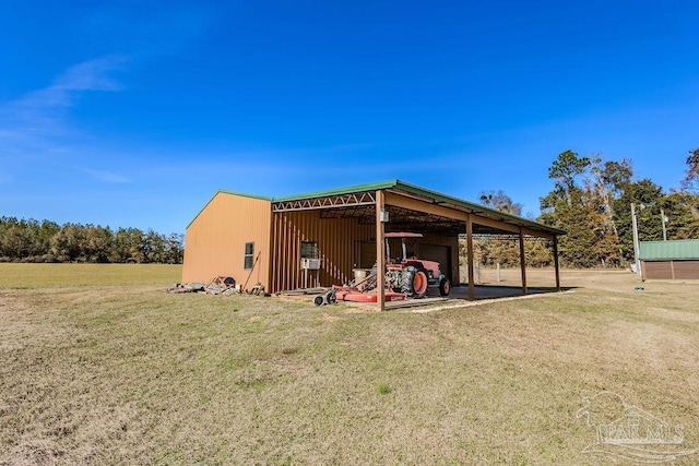 view of pole building with a yard