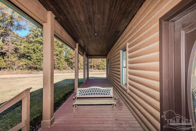 deck with a yard and a porch