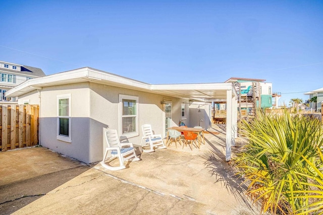 rear view of property featuring a patio