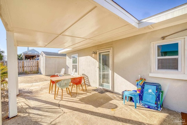 view of patio / terrace featuring a storage shed