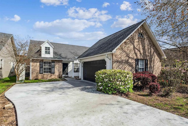 152 Mirabelle Cir, Pensacola, FL 32514 - view of front of home with brick siding, an attached garage, concrete driveway, and roof with shingles