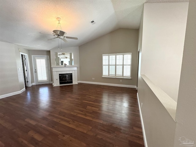 152 Mirabelle Cir, Pensacola, FL 32514 - unfurnished living room with a ceiling fan, dark wood-style flooring, a textured ceiling, a fireplace, and lofted ceiling