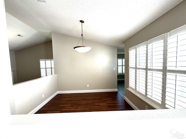 152 Mirabelle Cir, Pensacola, FL 32514 - unfurnished dining area with lofted ceiling, wood finished floors, baseboards, and a textured ceiling