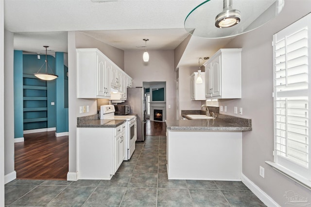 152 Mirabelle Cir, Pensacola, FL 32514 - kitchen with electric stove, a sink, white cabinetry, baseboards, and a textured ceiling