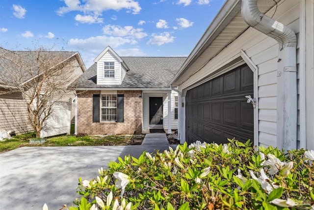 152 Mirabelle Cir, Pensacola, FL 32514 - view of front facade featuring brick siding, roof with shingles, and an attached garage