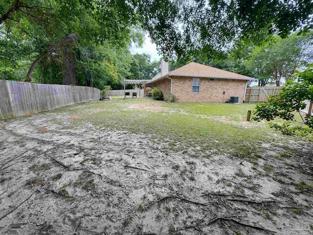 view of yard featuring a fenced backyard