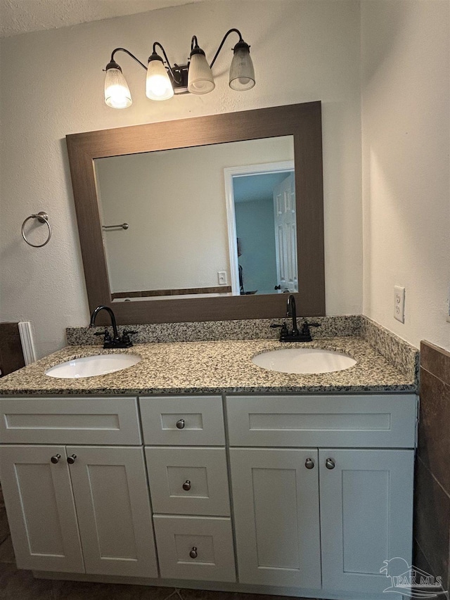 bathroom featuring vanity and a textured ceiling