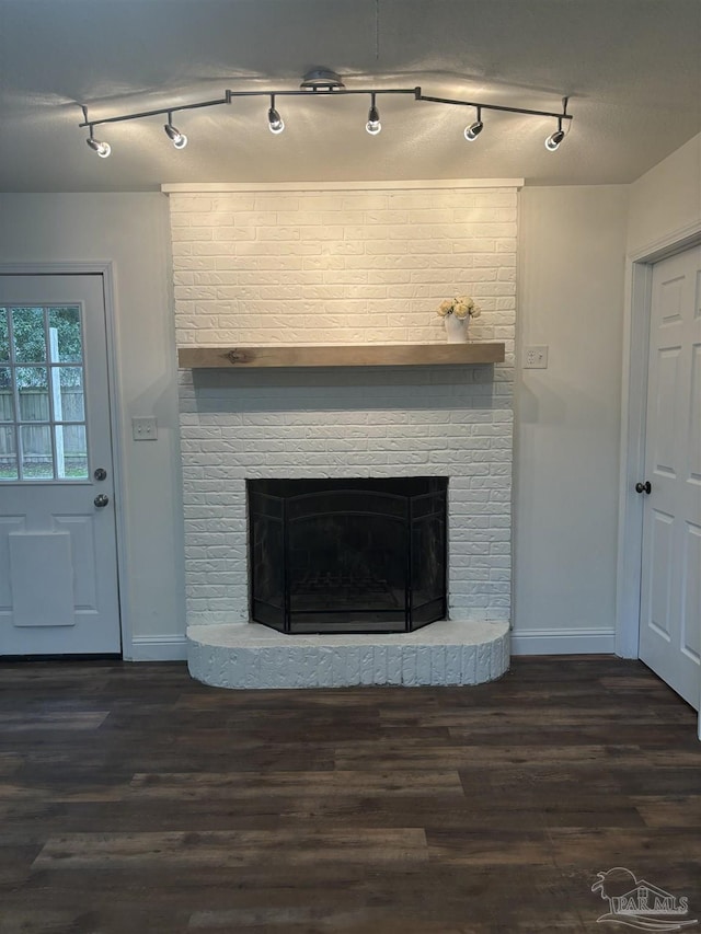 details featuring a brick fireplace and hardwood / wood-style flooring