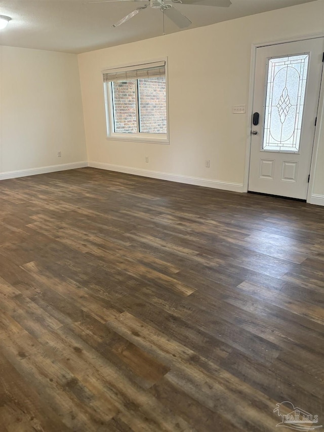 foyer entrance with dark hardwood / wood-style flooring and ceiling fan