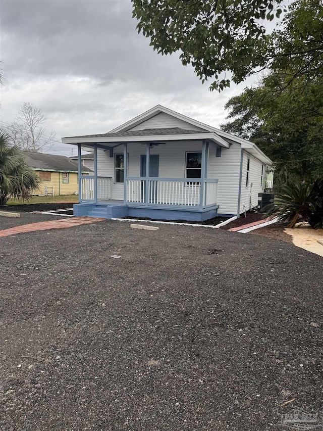 view of front of home with cooling unit and a porch