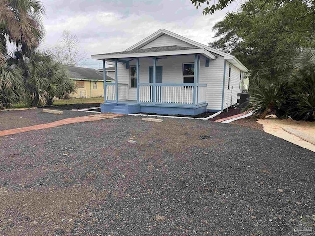 view of front of property with central AC and a porch