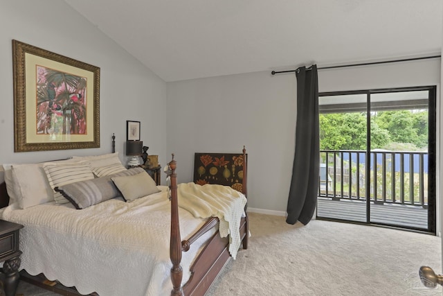 carpeted bedroom with vaulted ceiling, baseboards, and access to exterior