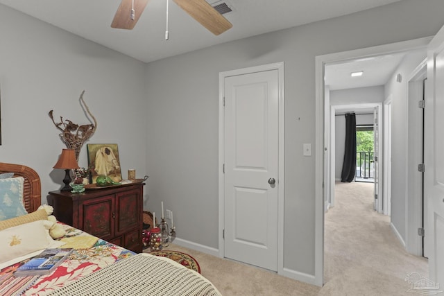 bedroom with baseboards, a ceiling fan, visible vents, and light colored carpet