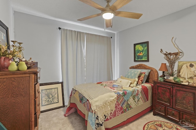 bedroom with a ceiling fan and light colored carpet