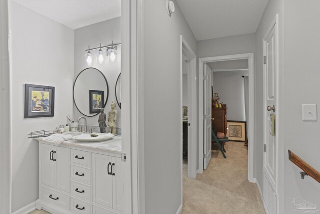 bathroom with baseboards and vanity
