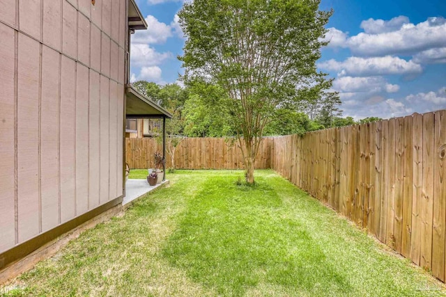 view of yard with a fenced backyard