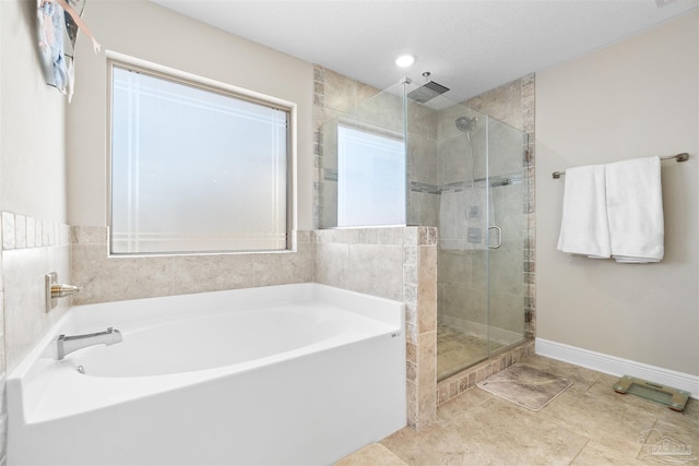 bathroom featuring separate shower and tub and tile patterned floors