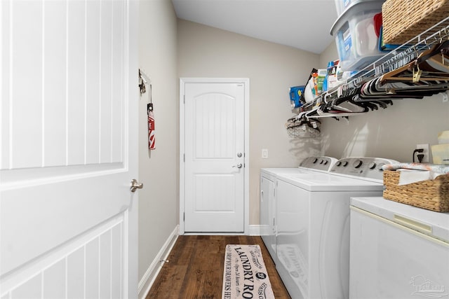 laundry area featuring dark wood-type flooring and washer and dryer