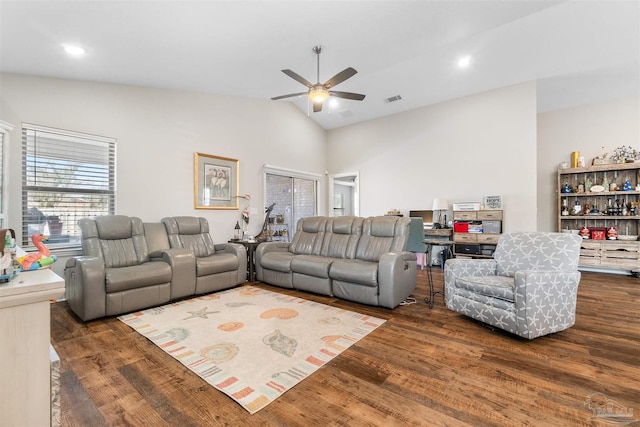 living room with vaulted ceiling, dark hardwood / wood-style floors, and ceiling fan