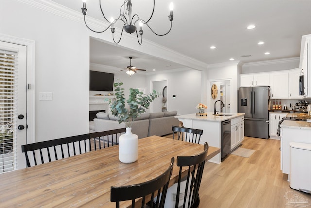 9938 Suwanee Ln, Pensacola, FL 32526 - dining area featuring crown molding, recessed lighting, light wood-type flooring, ceiling fan, and a chandelier