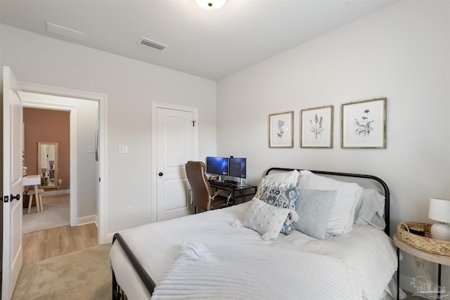 9938 Suwanee Ln, Pensacola, FL 32526 - bedroom with light carpet, baseboards, and light wood finished floors