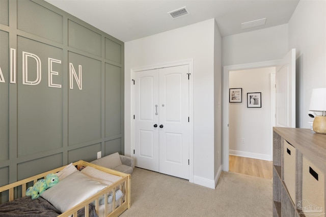 9938 Suwanee Ln, Pensacola, FL 32526 - bedroom with light carpet, a closet, and baseboards