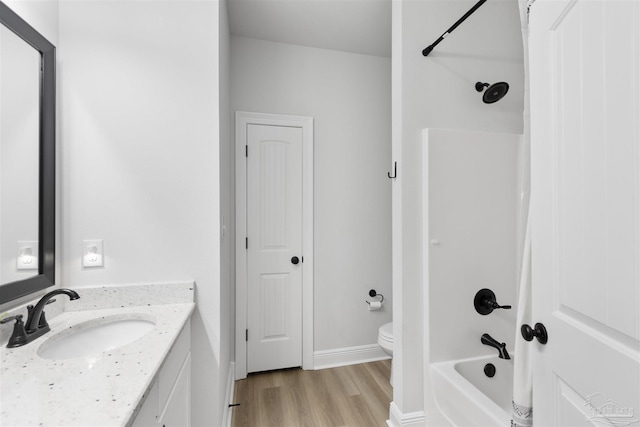 9938 Suwanee Ln, Pensacola, FL 32526 - full bath with vanity, wood finished floors, toilet, shower / bathtub combination, and baseboards