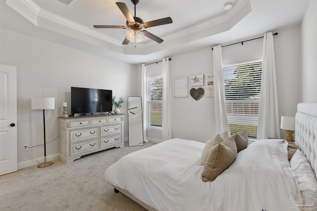 9938 Suwanee Ln, Pensacola, FL 32526 - bedroom featuring a tray ceiling, multiple windows, ornamental molding, and light carpet