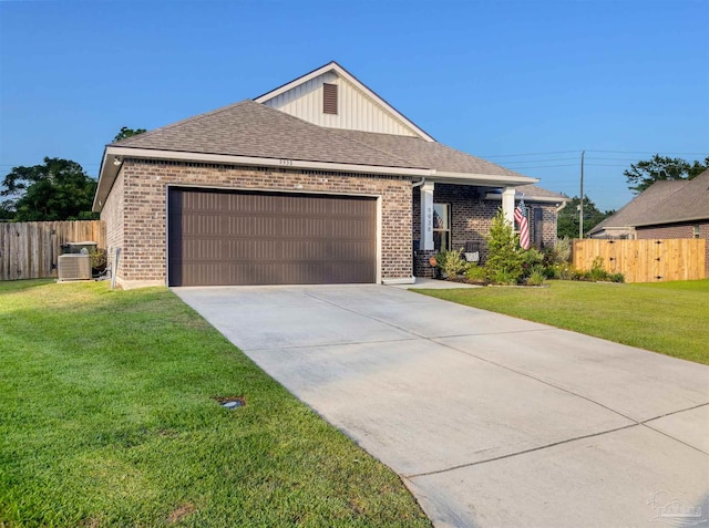 9938 Suwanee Ln, Pensacola, FL 32526 - view of front of property featuring brick siding, an attached garage, concrete driveway, cooling unit, and a shingled roof