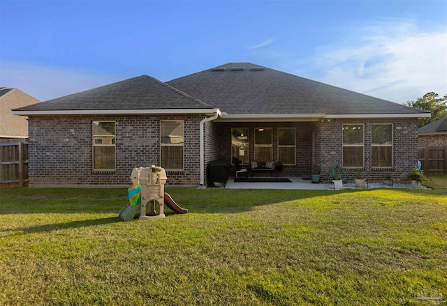 9938 Suwanee Ln, Pensacola, FL 32526 - back of house featuring a shingled roof, a patio, and brick siding