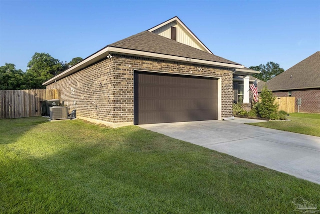 9938 Suwanee Ln, Pensacola, FL 32526 - view of front of property with brick siding, an attached garage, central AC unit, concrete driveway, and board and batten siding