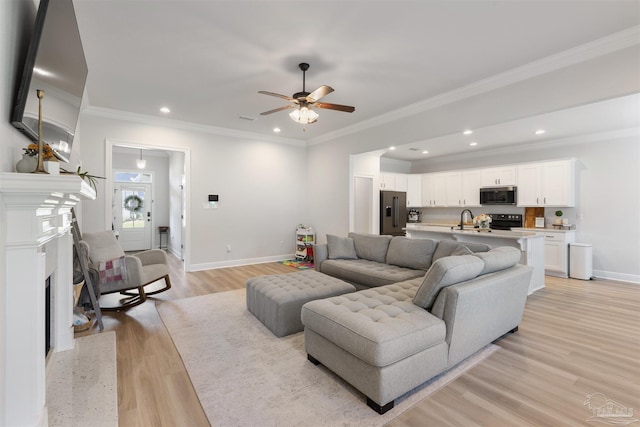 9938 Suwanee Ln, Pensacola, FL 32526 - living room with baseboards, ceiling fan, light wood finished floors, a fireplace with flush hearth, and recessed lighting