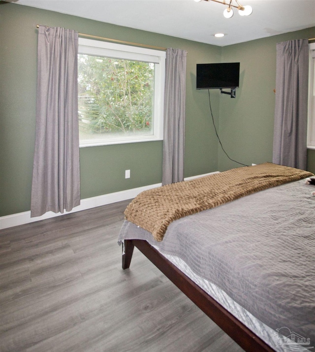 bedroom with wood-type flooring