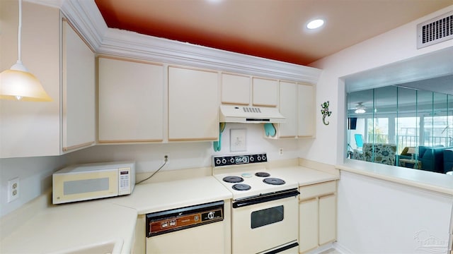 kitchen featuring white appliances, visible vents, light countertops, and under cabinet range hood