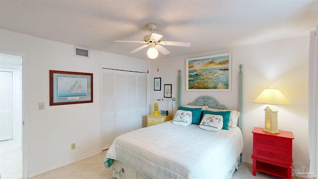 bedroom featuring a ceiling fan, baseboards, a closet, and visible vents