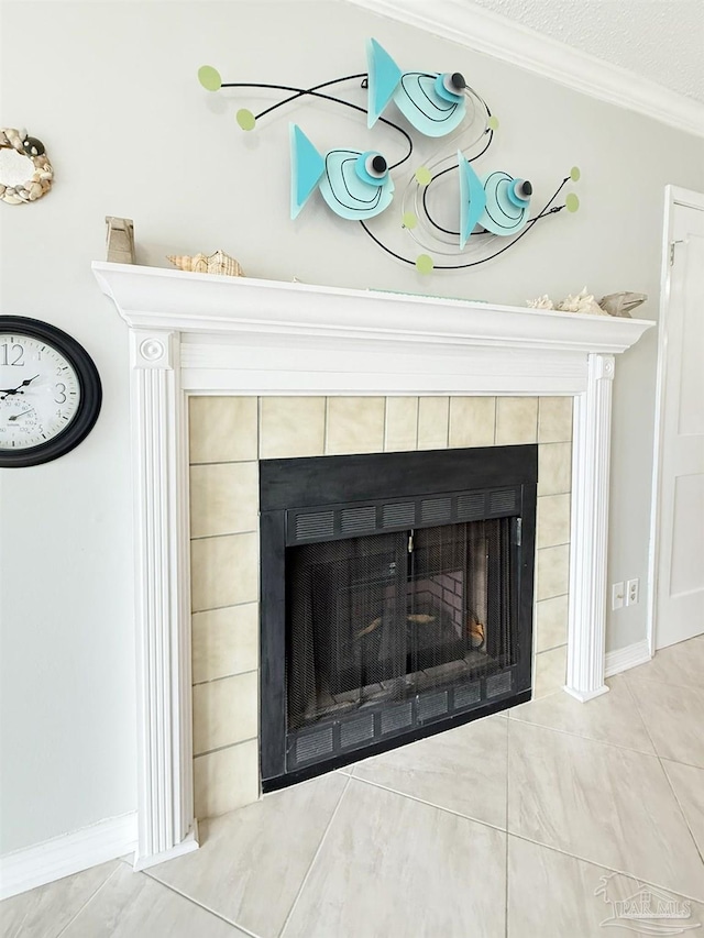 interior details with crown molding, a fireplace, and a textured ceiling