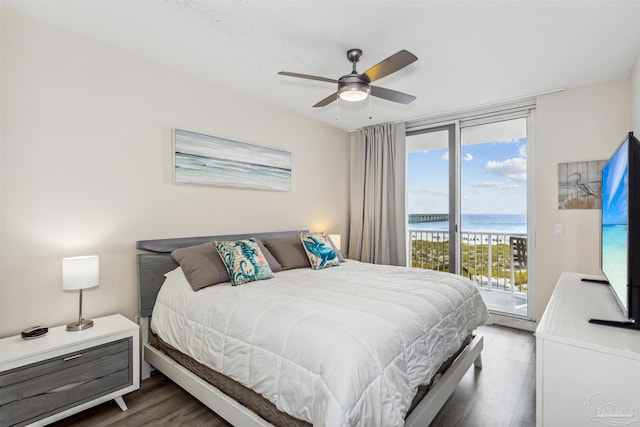 bedroom featuring ceiling fan, dark hardwood / wood-style floors, and access to outside