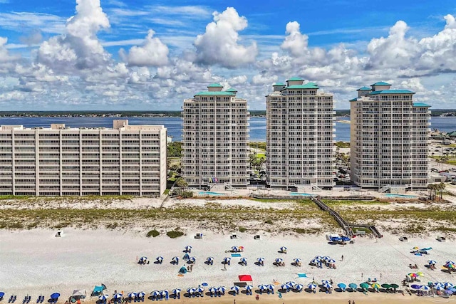 exterior space with a beach view and a water view